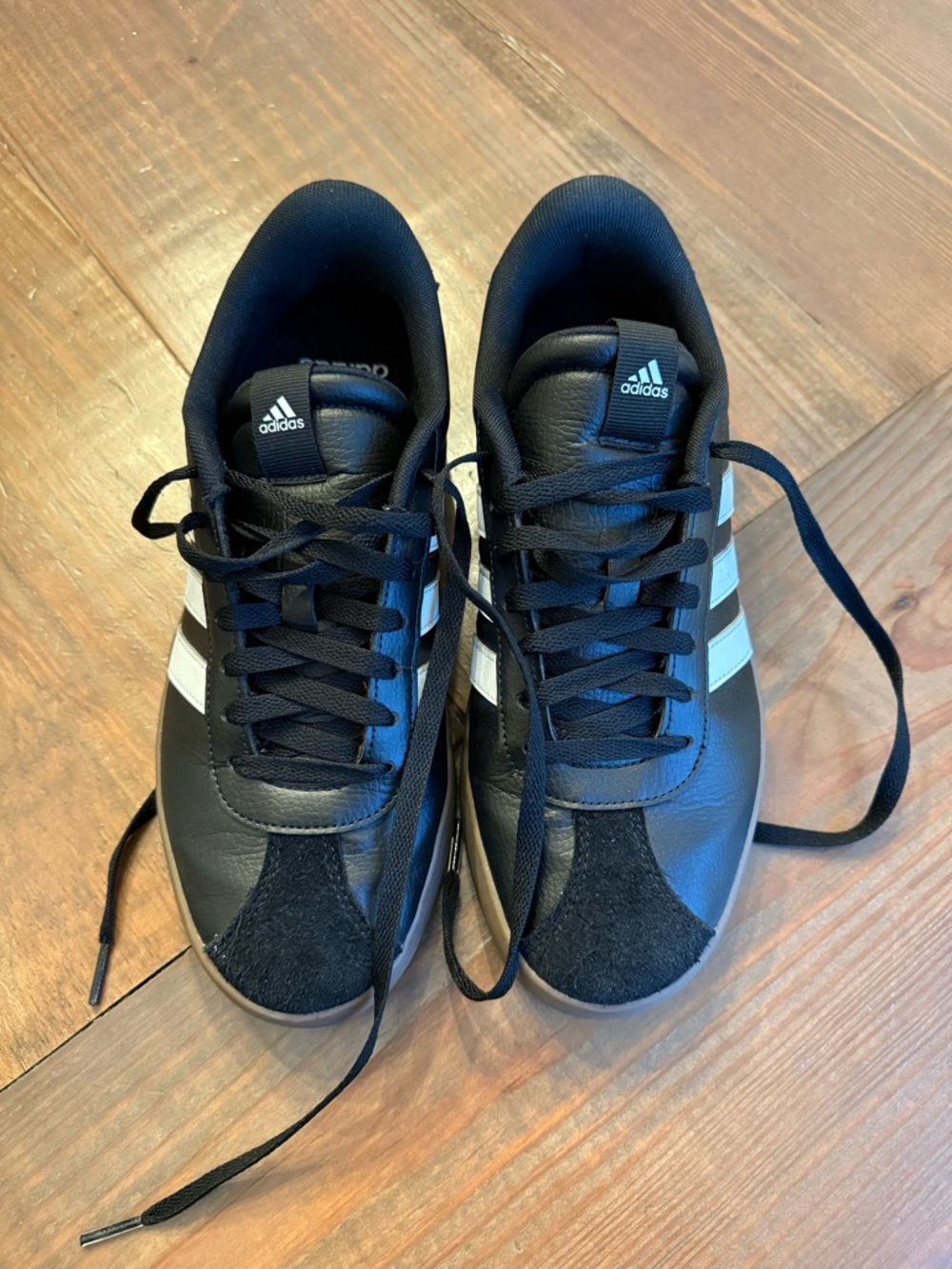 adidas black sneakers with white stripe